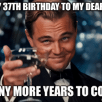 A man in a tuxedo raises a glass with the text 'Happy 37th Birthday to my dear wife. Many more years to come.'